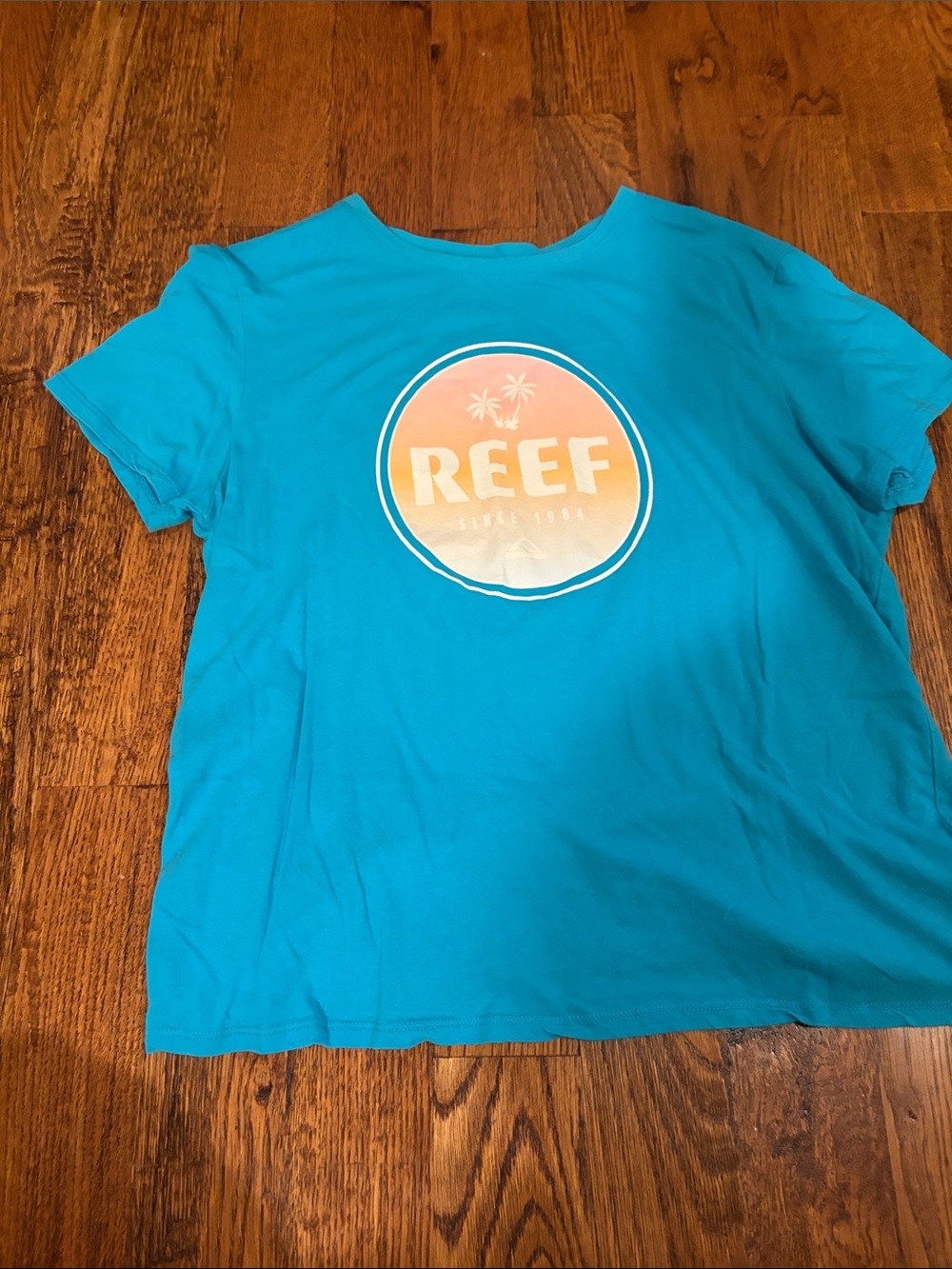Reef Bright Turquoise Logo Tee with Sunset Emblem
